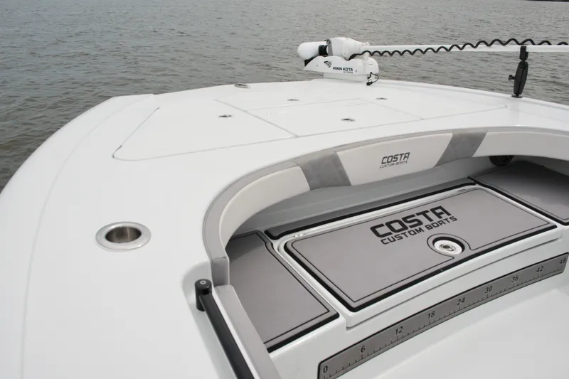 Slide: The Image of 2023 Costa Custom Boats 264 HC deck, featuring sleek design and modern amenities. - 30