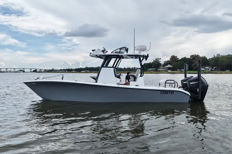 Slide: The Image of 2023 Costa Custom Boats 264 HC on calm water, showcasing sleek design and powerful engine. - 13