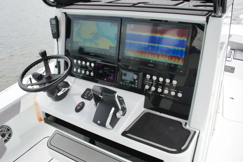 Slide: The Image of Control panel of 2023 Costa Custom Boats 264 HC with advanced navigation displays. - 44