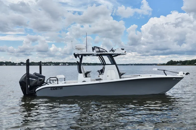 The Image of 2023 Costa Custom Boats 264 HC on calm water under cloudy sky. - 0