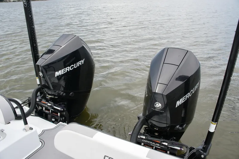 Slide: The Image of Twin Mercury outboard engines on 2023 Costa Custom Boats 264 HC in water. - 58