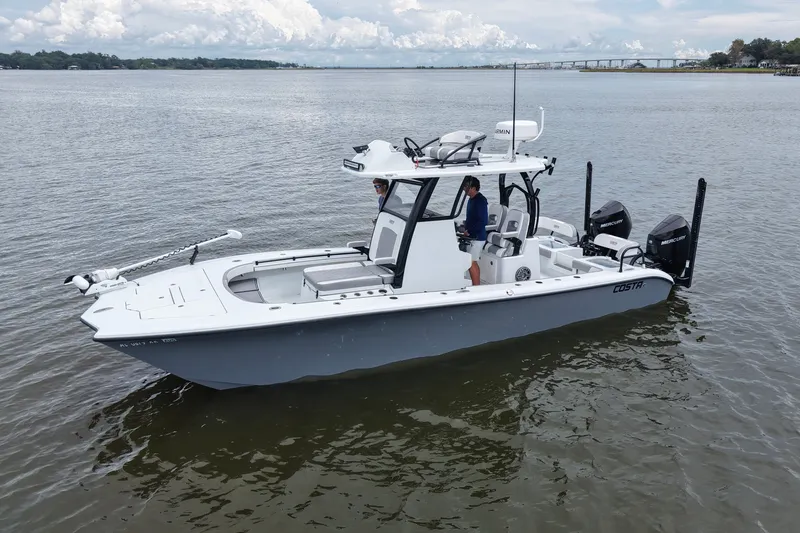 Slide: The Image of 2023 Costa Custom Boats 264 HC on calm water, featuring dual Mercury engines. - 28