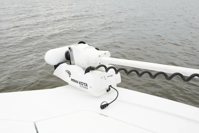 Slide: The Image of Minn Kota Ulterra motor on 2023 Costa Custom Boats 264 HC, near water. - 70