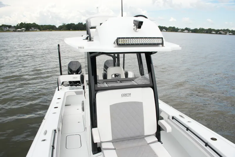 Slide: The Image of 2023 Costa Custom Boats 264 HC on water, showcasing sleek design and modern features. - 69