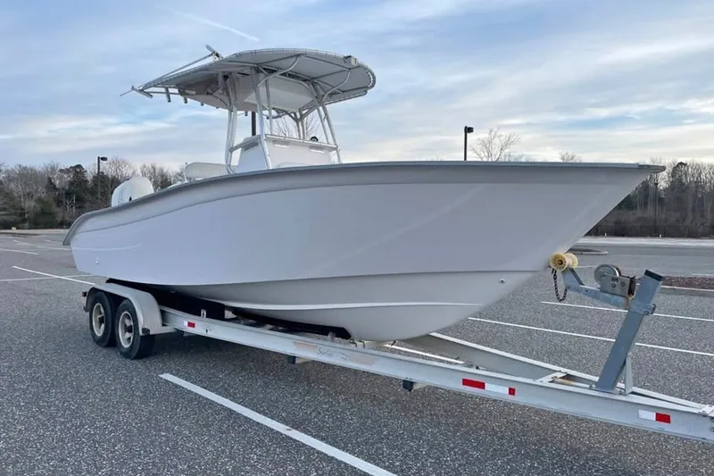 Slide: The Image of 2007 Cape Horn 24OS boat on trailer in parking lot, overcast sky. - 28