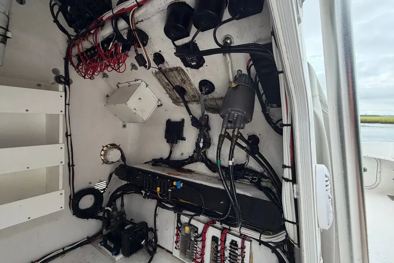 Slide: The Image of Electrical wiring and components inside a 2007 Cape Horn 24OS boat. - 26