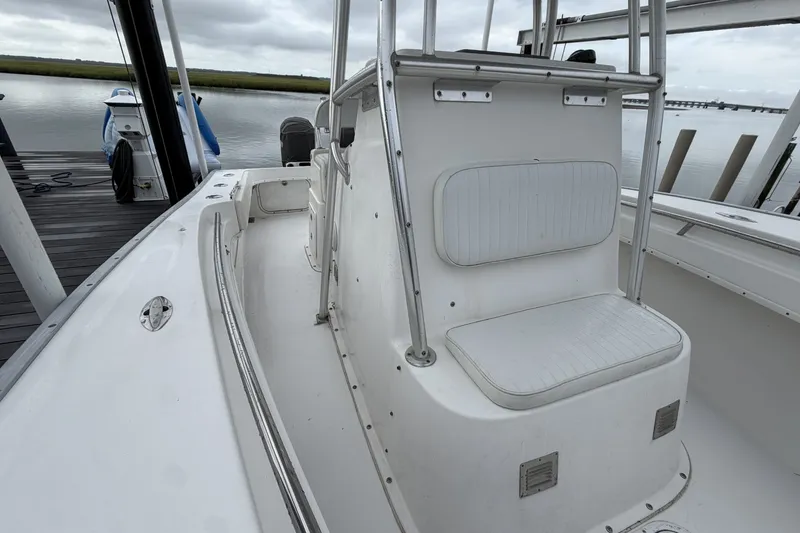 Slide: The Image of 2007 Cape Horn 24OS boat interior with seating, docked by calm waters. - 13