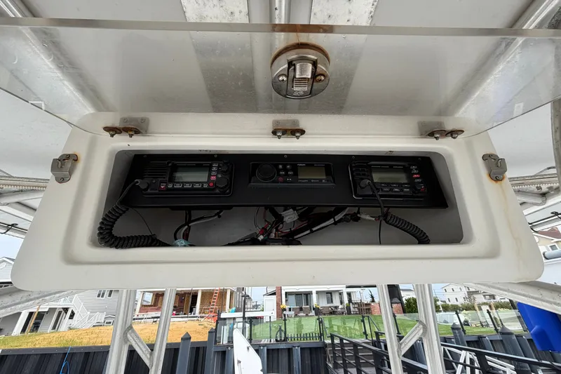 Slide: The Image of 2007 Cape Horn 24OS boat electronics compartment with communication devices. - 27