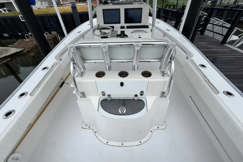 Slide: The Image of 2007 Cape Horn 24OS boat interior with helm, rod holders, and seating. - 20