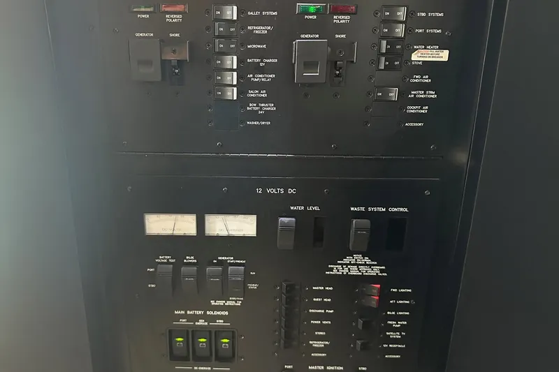 Slide: The Image of Electrical control panel of a 2003 Sea Ray 420 Sundancer yacht. - 18