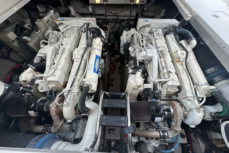 Slide: The Image of Engine compartment of a 2003 Sea Ray 420 Sundancer boat, showcasing dual engines. - 27