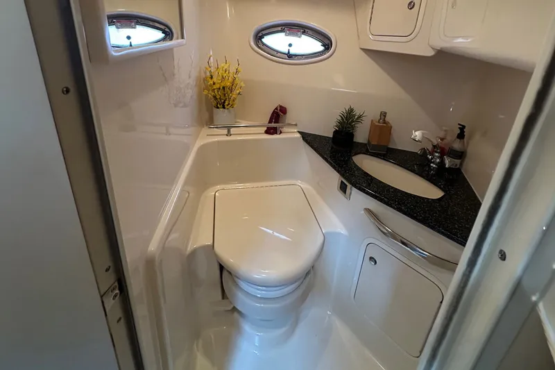 Slide: The Image of Bathroom interior of 2003 Sea Ray 420 Sundancer yacht, featuring modern amenities and sleek design. - 17