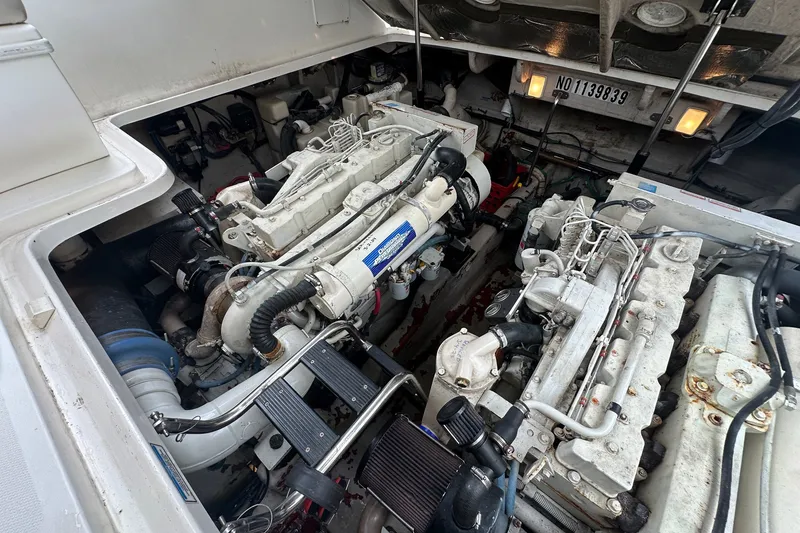 Slide: The Image of Engine compartment of a 2003 Sea Ray 420 Sundancer boat, showcasing dual engines. - 28