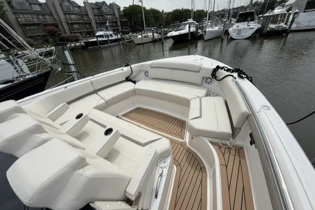 Slide: The Image of Luxurious 2024 Tiara Yachts 48 LS with spacious seating at marina dock. - 19