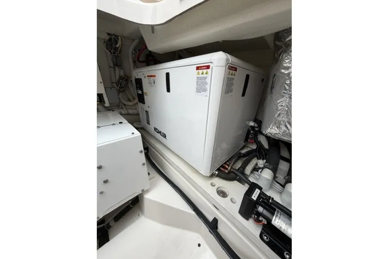 Slide: The Image of Engine compartment of 2024 Tiara Yachts 48 LS featuring Kohler generator. - 29