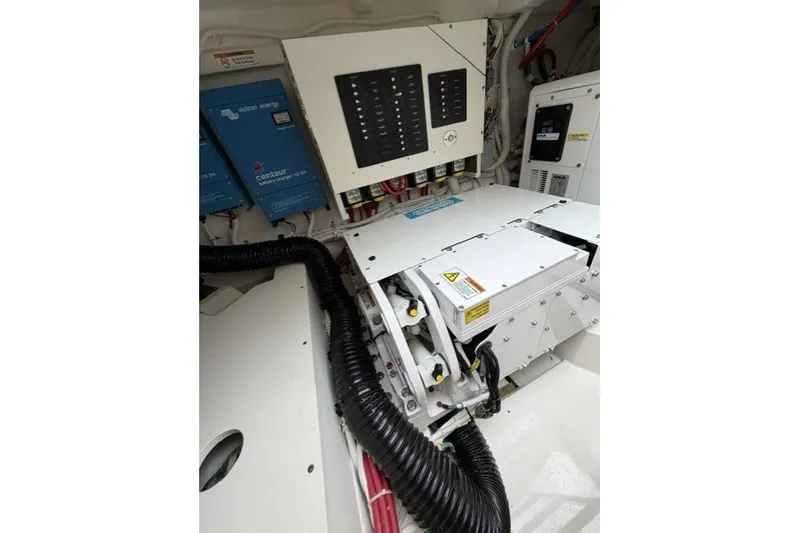 Slide: The Image of Engine room of 2024 Tiara Yachts 48 LS, showcasing electrical systems and components. - 27