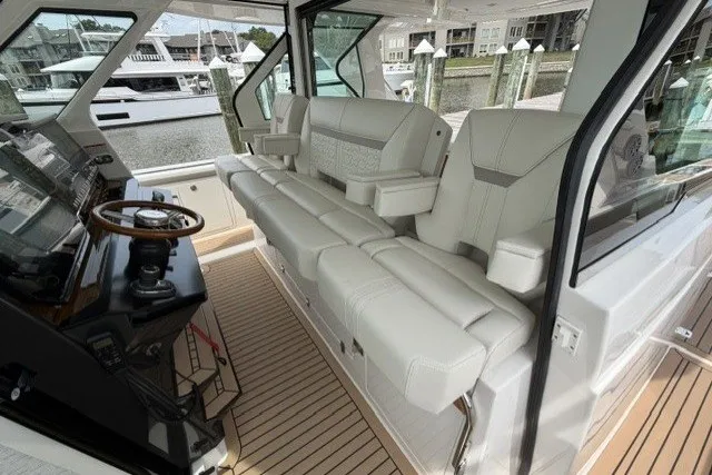 Slide: The Image of 2024 Tiara Yachts 48 LS interior with luxurious seating and modern helm. - 12