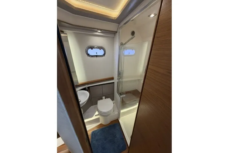 Slide: The Image of Luxurious bathroom interior of 2024 Tiara Yachts 48 LS with modern fixtures. - 26