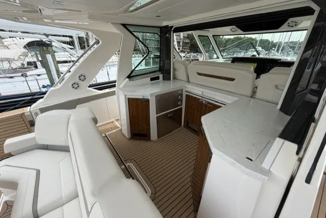 Slide: The Image of 2024 Tiara Yachts 48 LS interior with luxurious seating and modern design. - 8