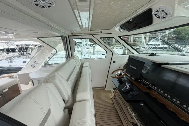 Slide: The Image of Luxurious interior of 2024 Tiara Yachts 48 LS, featuring plush seating and advanced navigation controls. - 14