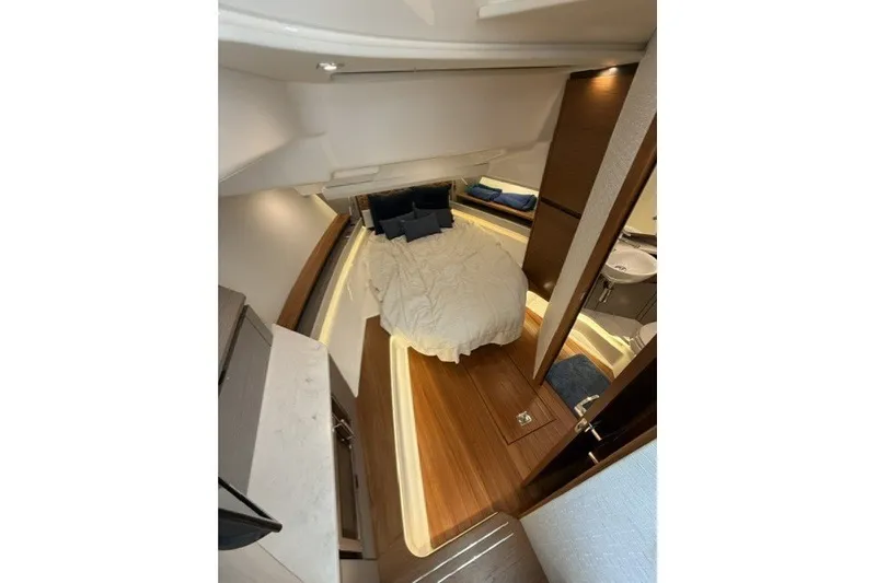 Slide: The Image of Luxurious interior cabin of 2024 Tiara Yachts 48 LS with cozy bedding and modern design. - 23