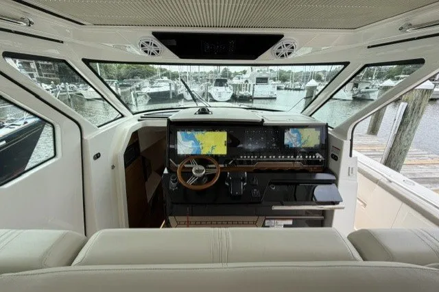 Slide: The Image of 2024 Tiara Yachts 48 LS helm with advanced navigation displays and luxurious interior. - 15