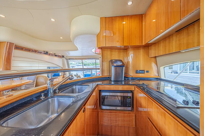 Slide: The Image of Luxurious kitchen interior of a 2008 Azimut 62 yacht with modern amenities. - 26