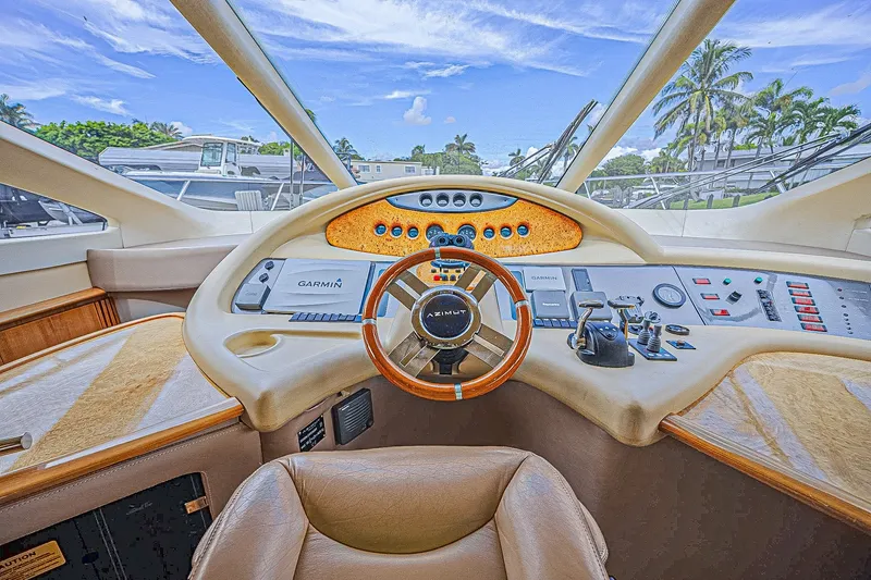 Slide: The Image of Luxurious 2008 Azimut 62 yacht helm with advanced navigation controls and panoramic view. - 31