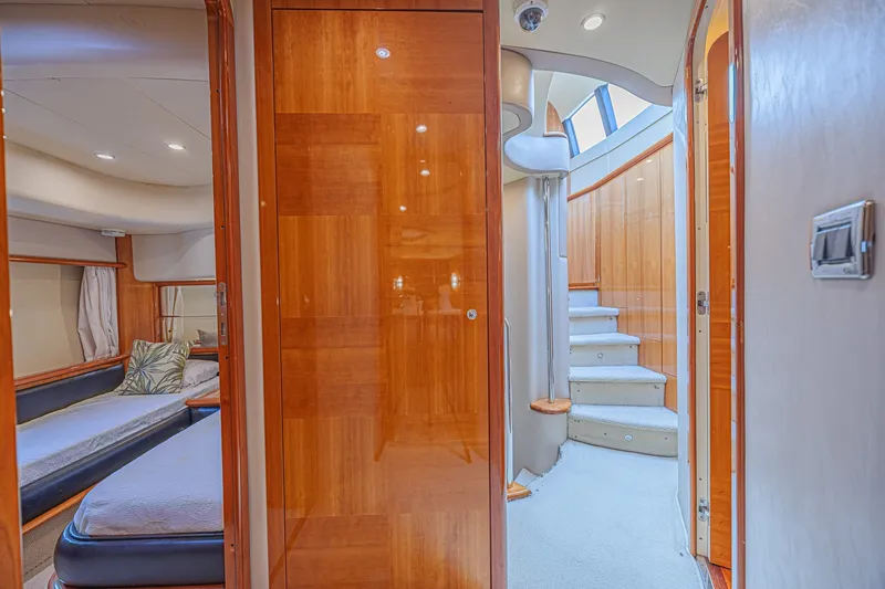 Slide: The Image of Luxurious interior of 2008 Azimut 62 yacht with wooden finishes and elegant staircase. - 33