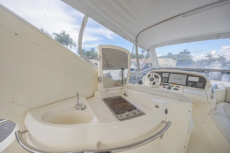 Slide: The Image of Luxurious 2008 Azimut 62 yacht helm with grill and navigation equipment. - 7