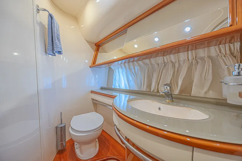 Slide: The Image of Luxurious bathroom interior of a 2008 Azimut 62 yacht, featuring elegant fixtures and wood accents. - 35