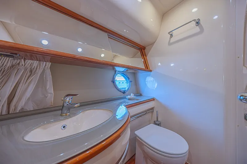 Slide: The Image of Luxurious bathroom interior of 2008 Azimut 62 yacht with modern fixtures and porthole window. - 47