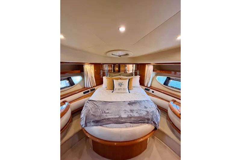Slide: The Image of Luxurious interior of a 2008 Azimut 62 yacht with elegant bedding and wood finishes. - 42