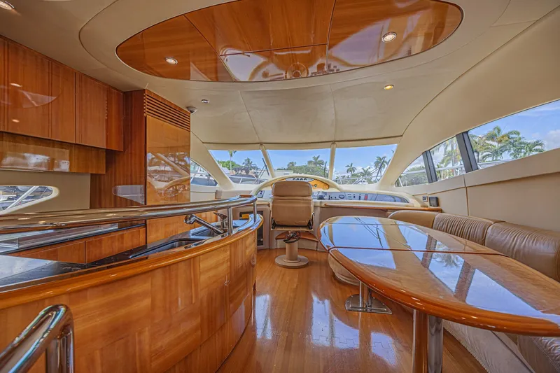 Slide: The Image of Luxurious interior of a 2008 Azimut 62 yacht with polished wood and panoramic windows. - 22