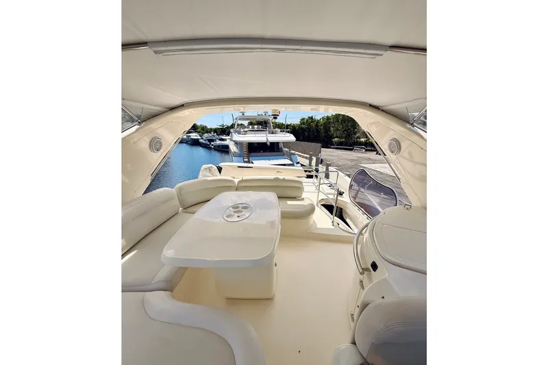 Slide: The Image of Luxurious interior of a 2008 Azimut 62 yacht with elegant seating and table. - 11