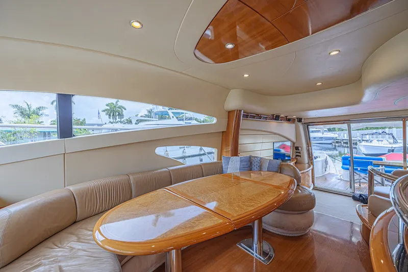Slide: The Image of Luxurious interior of a 2008 Azimut 62 yacht with elegant wood finishes and plush seating. - 23