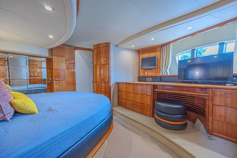 Slide: The Image of Luxurious interior of a 2008 Azimut 62 yacht with elegant wood finishes and modern amenities. - 53