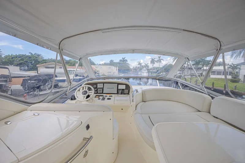 Slide: The Image of Interior view of 2008 Azimut 62 yacht cockpit with steering wheel and seating area. - 8