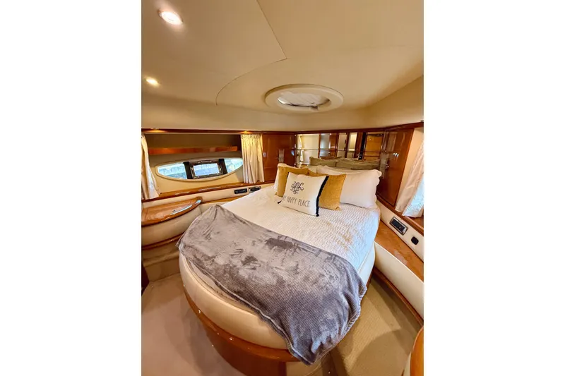 Slide: The Image of Luxurious bedroom interior of a 2008 Azimut 62 yacht with cozy bedding. - 41