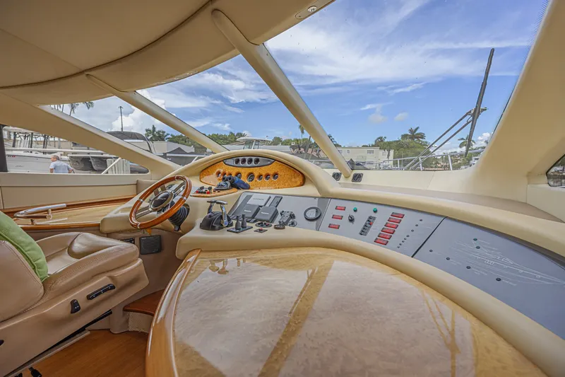 Slide: The Image of Luxurious interior of a 2008 Azimut 62 yacht with modern dashboard and steering wheel. - 30