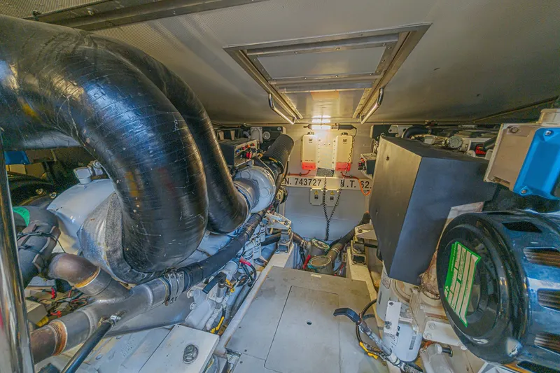 Slide: The Image of Engine room of a 2008 Azimut 62 yacht, showcasing mechanical components and systems. - 65