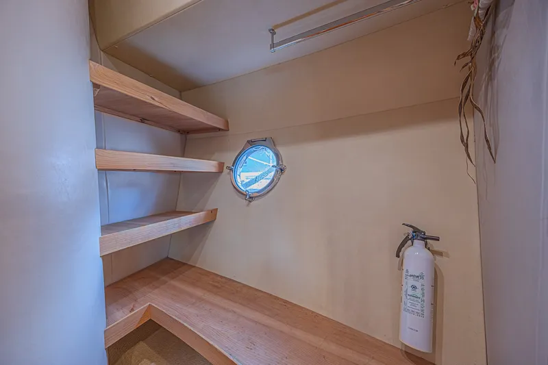Slide: The Image of Wooden shelves and porthole in 2008 Azimut 62 yacht interior. - 46