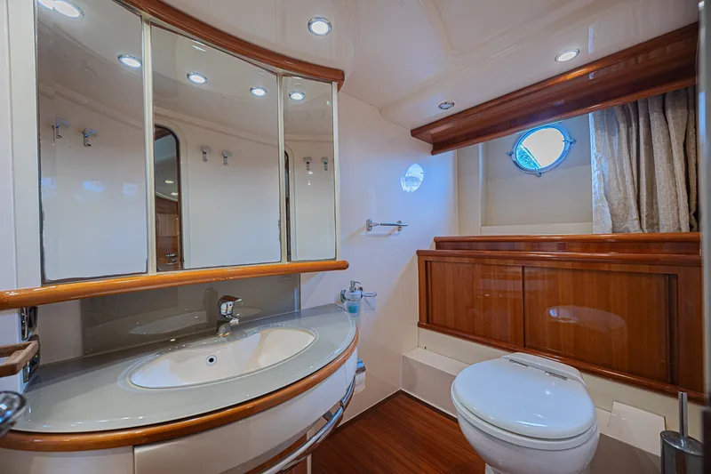 Slide: The Image of Luxurious bathroom interior of a 2008 Azimut 62 yacht with elegant wood finishes. - 59