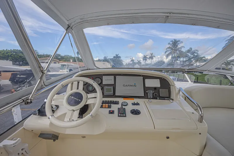 Slide: The Image of Cockpit of 2008 Azimut 62 yacht with Garmin navigation system and steering wheel. - 9