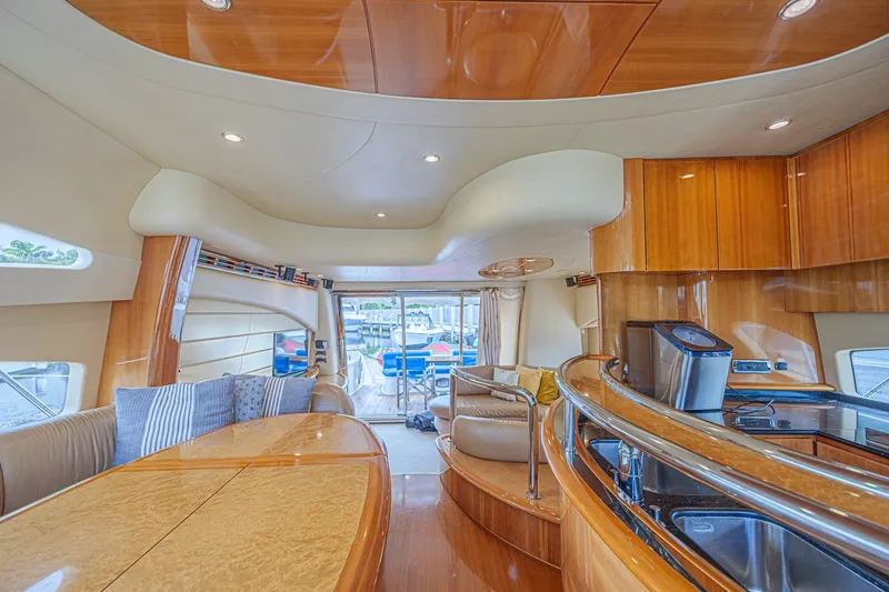 Slide: The Image of Luxurious interior of a 2008 Azimut 62 yacht with elegant wood finishes and modern amenities. - 24