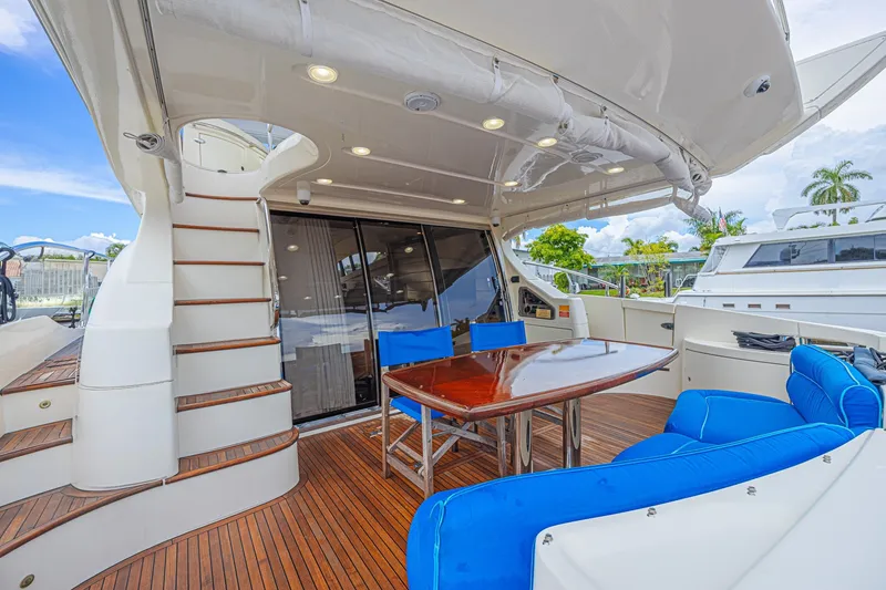 Slide: The Image of Luxurious 2008 Azimut 62 yacht deck with seating and dining area. - 15
