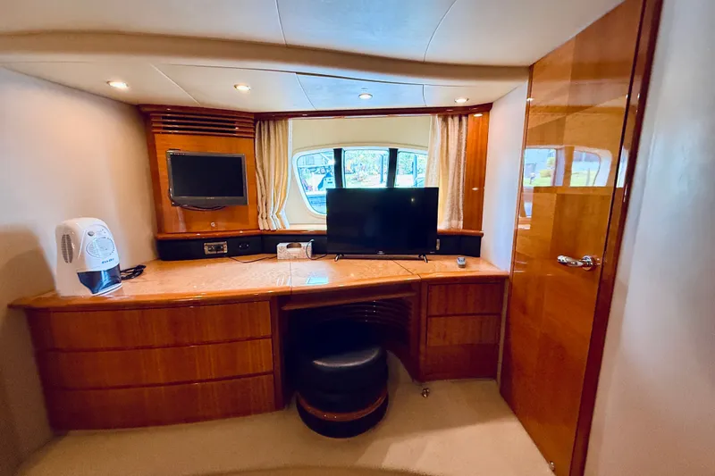 Slide: The Image of Luxurious interior of 2008 Azimut 62 yacht with wooden cabinetry and modern amenities. - 56