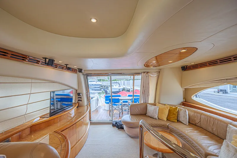 Slide: The Image of Luxurious interior of a 2008 Azimut 62 yacht with plush seating and elegant design. - 29