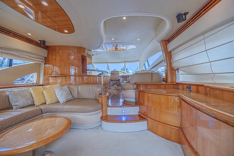 Slide: The Image of Luxurious interior of a 2008 Azimut 62 yacht with elegant wood finishes and plush seating. - 18
