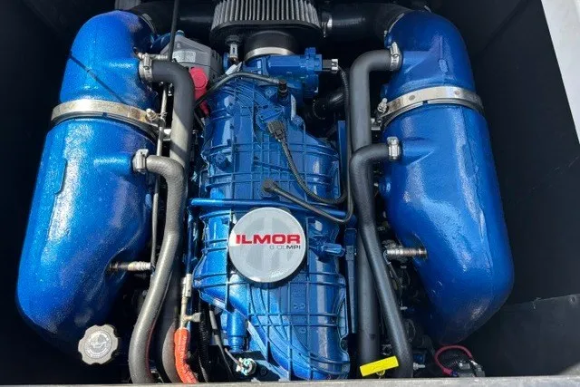 Slide: The Image of 2022 MasterCraft NXT22 Ilmor engine, blue components, detailed view. - 8